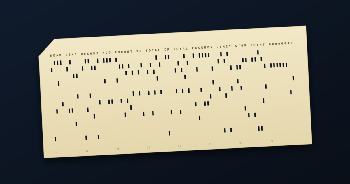 A cream 80-column punched card with rows of rectangular holes on a dark background